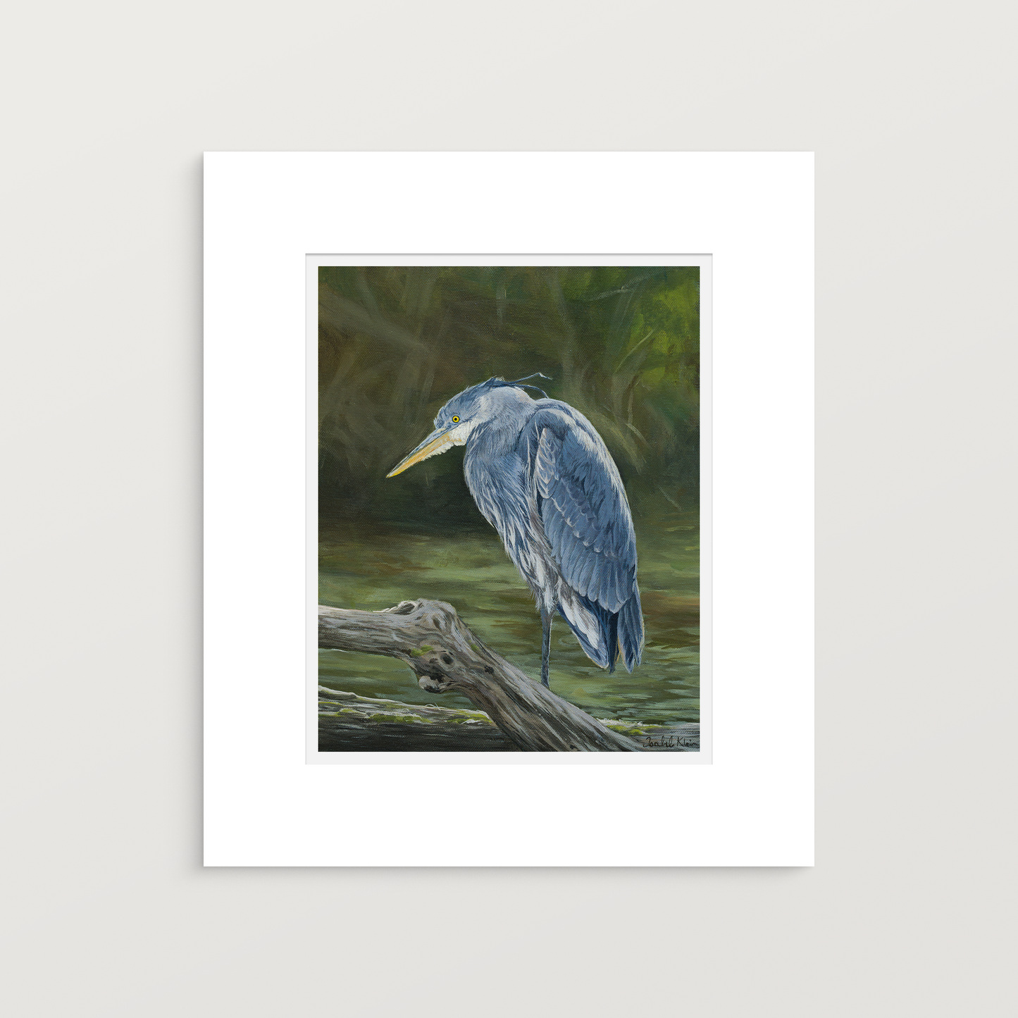 A matted art print featuring a painted blue heron standing on a log in a wetland scene, shown against a light gray background.