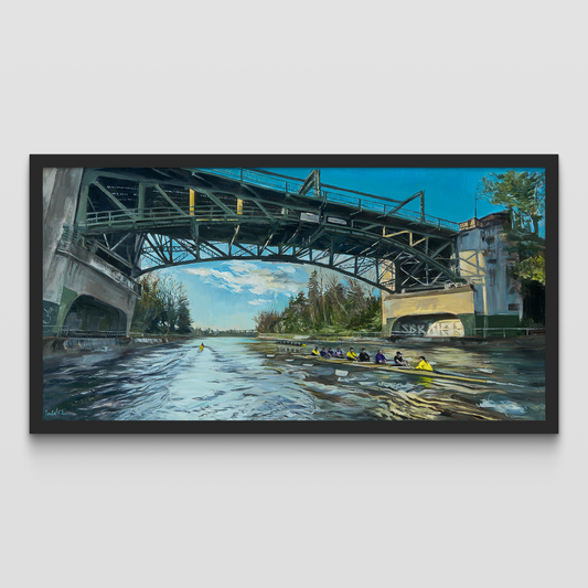 Framed artwork of a bridge over a river with rowers.