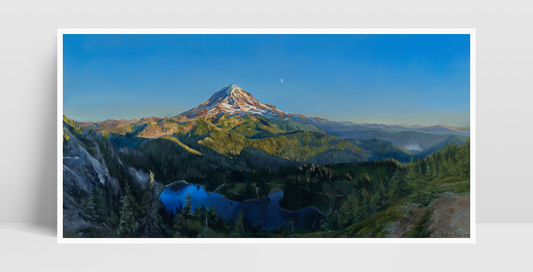 A print of an acrylic painting propped against a white wall.

The painting is a vibrant realistic landscape of Mount Rainier in the summer. It overlooks Mowich Lake. The sun is setting, casting golden light on the mountain and surrounding hills. The moon can be seen faintly beyond the mountain.