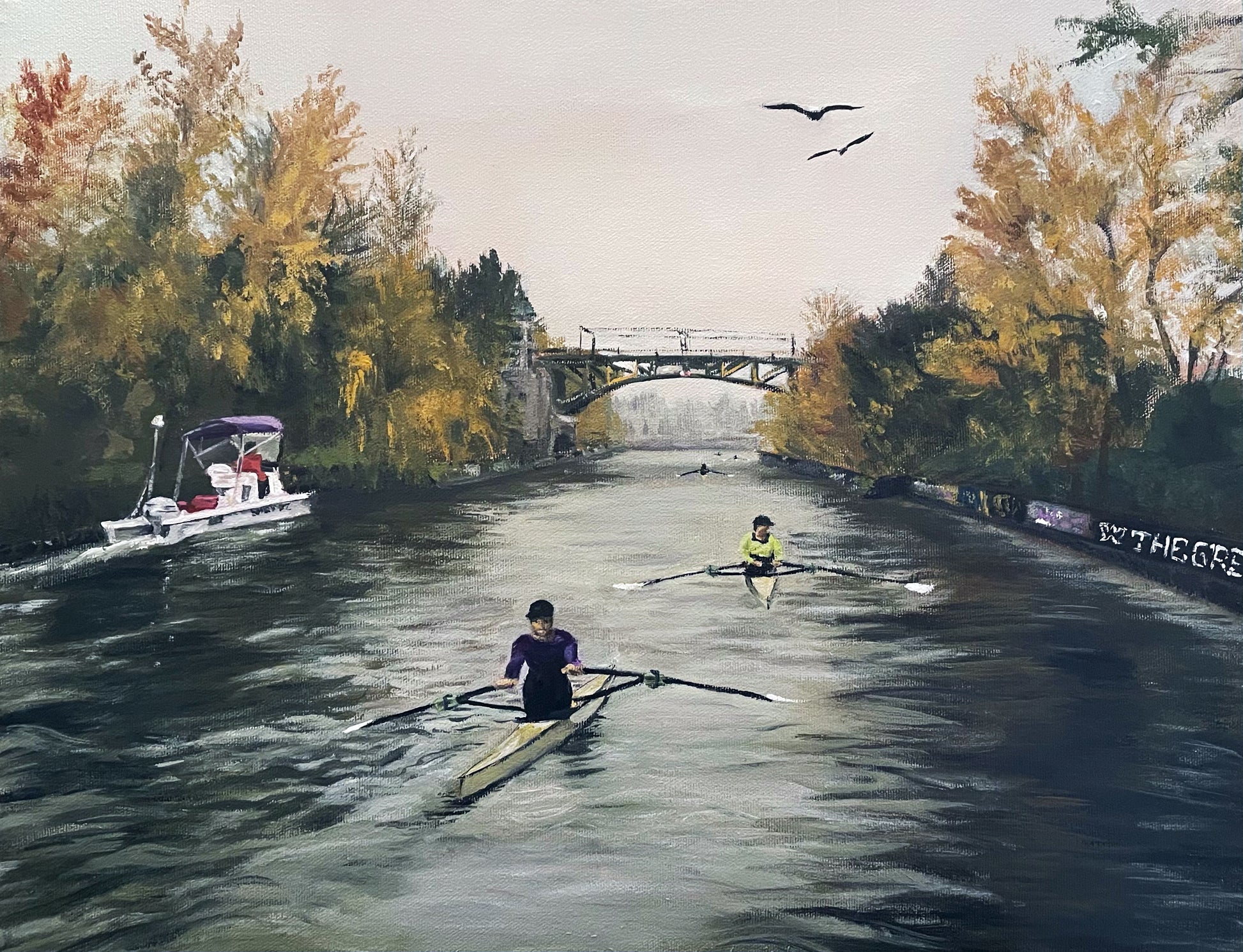 An acrylic painting of 2 men in single-person rowing shells rowing down the Montlake Cut in Seattle. There is a coaching launch to the left. In the distance is the Montlake bridge and 3 more distant rowers. The canal is lined with yellow and green fall trees. Two eagles fly overhead. 